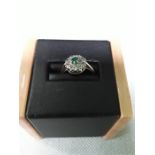 An emerald ring.