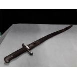 A WWI bayonet in scabbard.