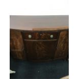 A reproduction mahogany bow fronted sideboard.