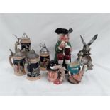 Three Royal Doulton Toby jugs together with four steins and a bird ornament.