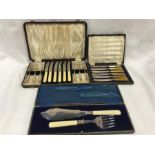 Three boxes of vintage silver plate cutlery.