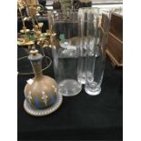 A Doulton design slip overlay Pompeii ware wine ewer and three glass vases.