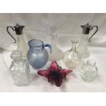 Collection of 8 decrotive pieces of glassware to include jugs and decanters.