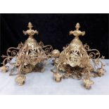 A pair of brass french design ceiling lights with attached candle holders on chains