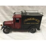 A reproduction wooden painted model of a vintage lorry.