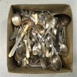 A box of cutlery, mostly silver plated.