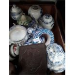 A box containing various blue and white china to include ginger jars.