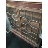 A Chippendale design adastrial glazed mahogany glass fronted display cabinet.