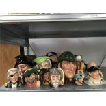 A large collection of Royal Doulton character jugs including Nelson old salt, smuggler, holder,