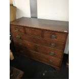 A walnutchest of three small over three large drawers.