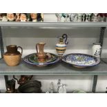 A quantity of china and pottery items including Doulton slipware hunting jug, Italian chargers,