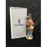 A Lladro Sad Sax figure with box.