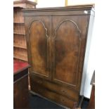 A large mahogany and flame veneered walnut double wardrobe.