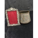 A silver photo frame and a Cairo ware silver on brass overlaid pot.