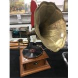 A reproduction ‘HMV’ gramophone with horn.