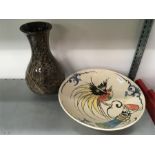 A large bowl with bird decoration together with a glass effect vase.