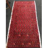 A handmade red ground Persian carpet. runner No. 252, 130 x 70 cm, Torkaman.