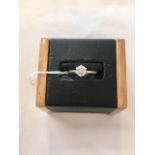 A diamond solitaire 18ct gold ring (approx 0.6 points).