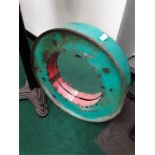 A round green drum mirror.