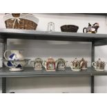 Six Sadler teapots together with a Poole Pottery washbowl and jug.