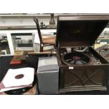 A vintage HMV gramophone together with a collection of 78’s.