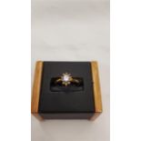 A new 9 carat gold topaz and diamond ring, size O.