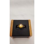 A new 9 carat gold citrine and diamond ring, size N.