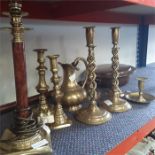 Various brass ware to include candlesticks, a jug, a lamp and a bedpan.