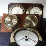 Two wall hanging ships clocks and barometer together with a Crompton Parkinson meter.