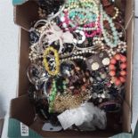 A box containing various costume jewellery.