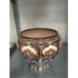 A Wardle Art Nouveau jardiniere in green and brown slip.