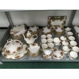 A large collection of Country Roses tea and dinner ware including soup bowls, tureens, serving