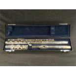 A Buffet and Crampon 6000 series flute in case with outer carrying case.