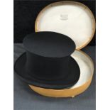 A silk opera top hat by Gerrard for Austin Reed Ltd. London, in original box.