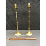 A pair of tall brass candle sticks and snuffer together with a lignum vitae rule.