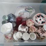 A box containing the residue of various tea sets.