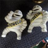 Two cast metal Michelin men.