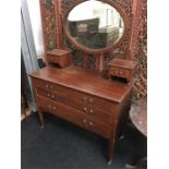 A Victorian mahogany mirrored top chest of three drawers.