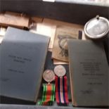 A box of RAF log books, certificates of service, photographs, medals etc.