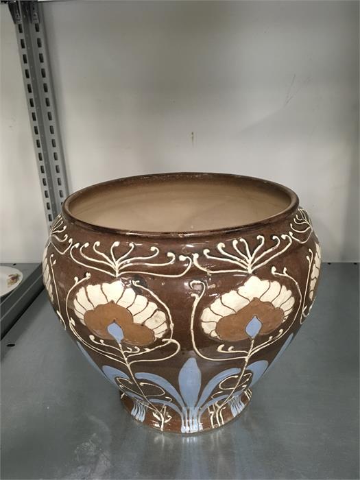 A Wardle Art Nouveau jardiniere in green and brown slip.