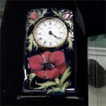 A Moorcroft clock in the anemone pattern.