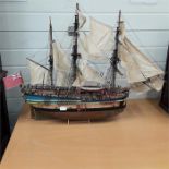 A large wooden model of a ship.