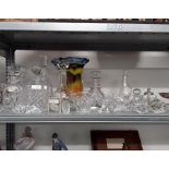 A collection of crystal glass decanters with other glass.