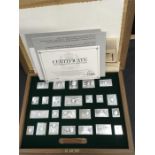 A boxed set of silver replicas of The Stamps of Royalty.