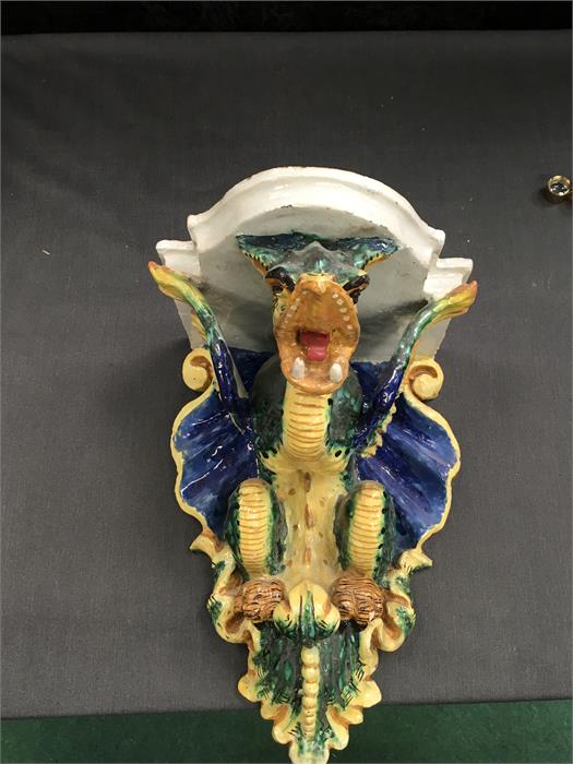A majolica wall bracket in the form of a dragon