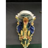 A majolica wall bracket in the form of a dragon