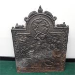 A cast iron fire back dated" 1644" of George slaying the dragon. 27.5 inches wide by 37.5 inches