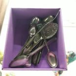 A box of silver and plated spoons, etc.