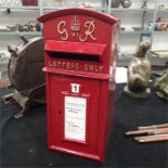 A red painted cast iron GR GPO postbox.