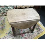 An arts and crafts small oak gate leg table.